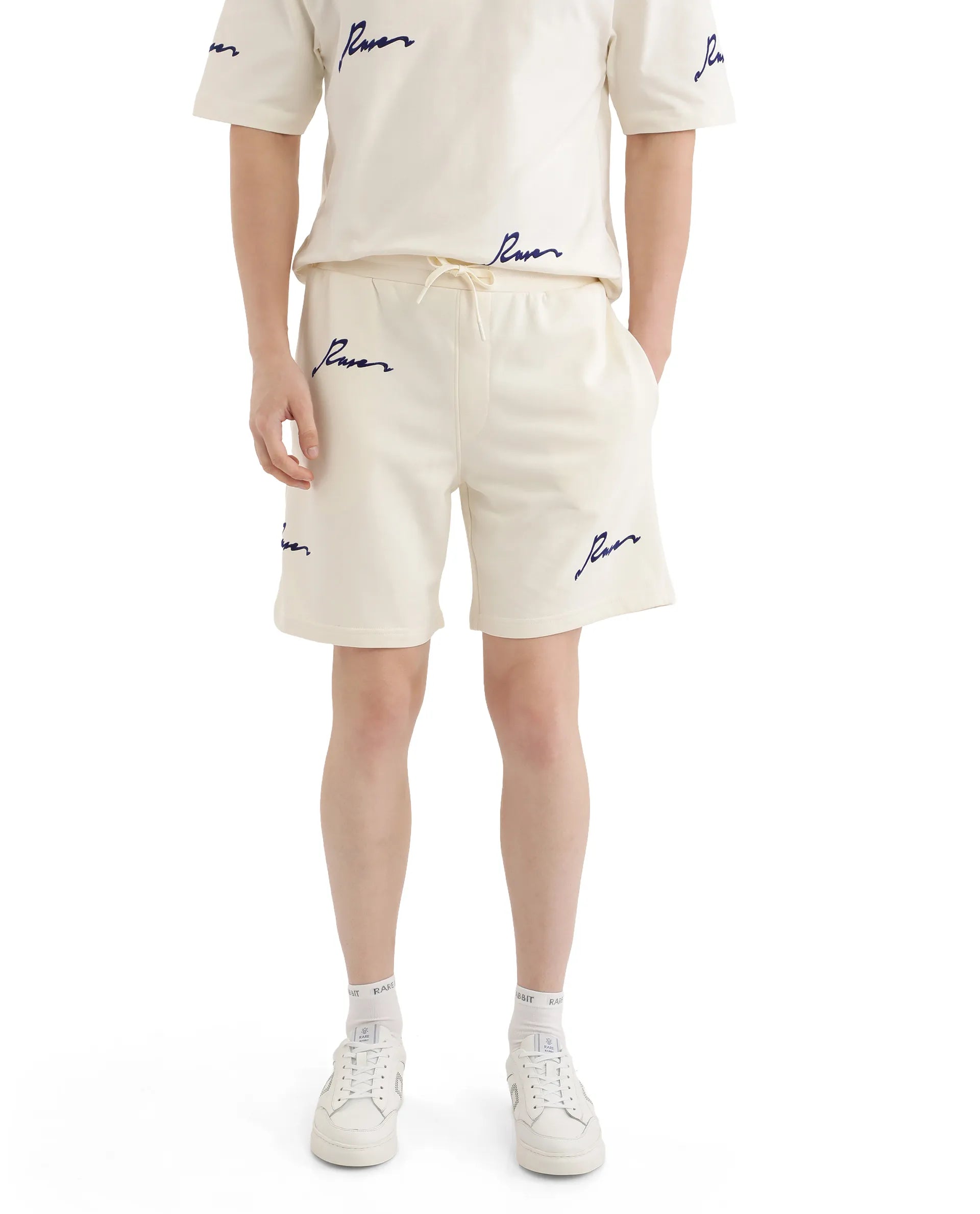 Men's Pants with Flat-Front DesignsRare Rabbit Men Erken-B Off White Cotton Polyester Fabric Short Sleeve Boxy Fit Typography Print Shorts Men's Pants with Flat-Front DesignsRare Rabbit Men Erken-B Off White Cotton Polyester Fabric Short Sleeve Boxy Fit Typography Print Shorts